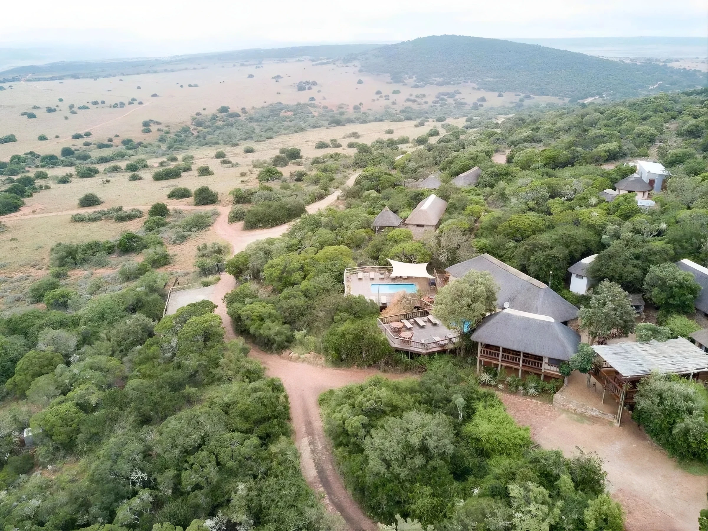 Woodbury Lodge stone-and-thatch suites above the Bushman's River, Amakhala